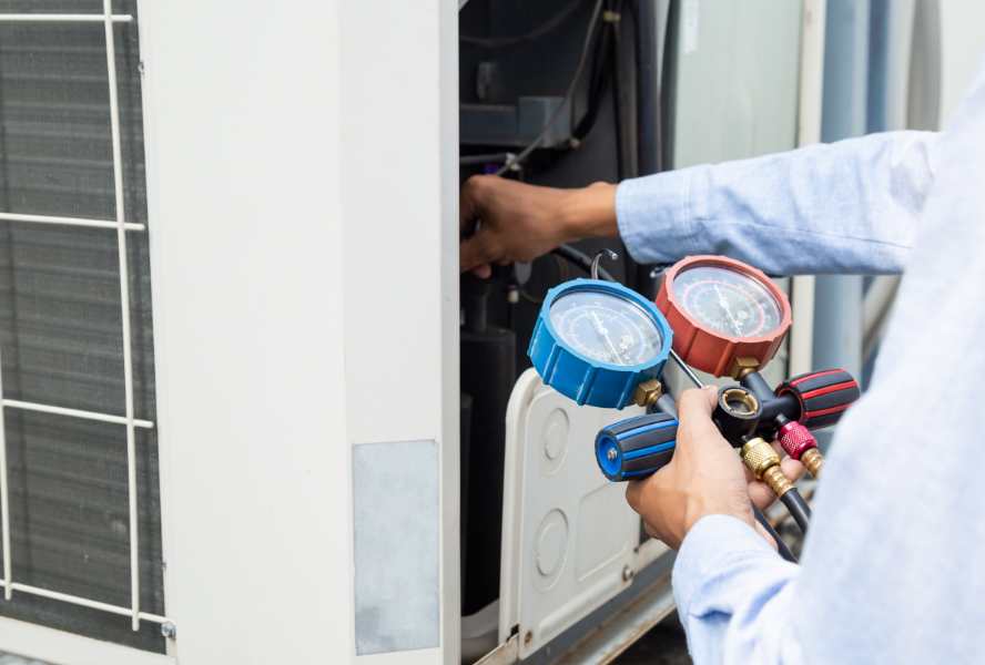 technician fixing and air conditioner