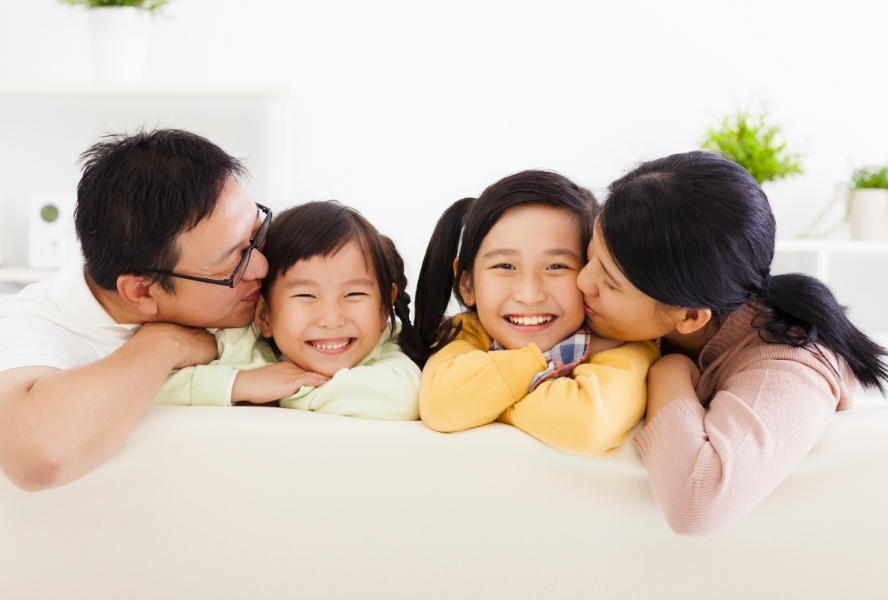 family sitting on a couch indoors