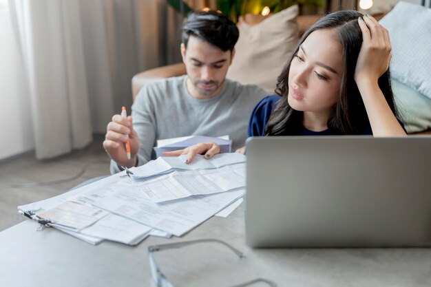 imgi_106_home-financehusband-wife-discussing-paper-bill-receipt-together-with-stress-confused-feeling-with-many-p