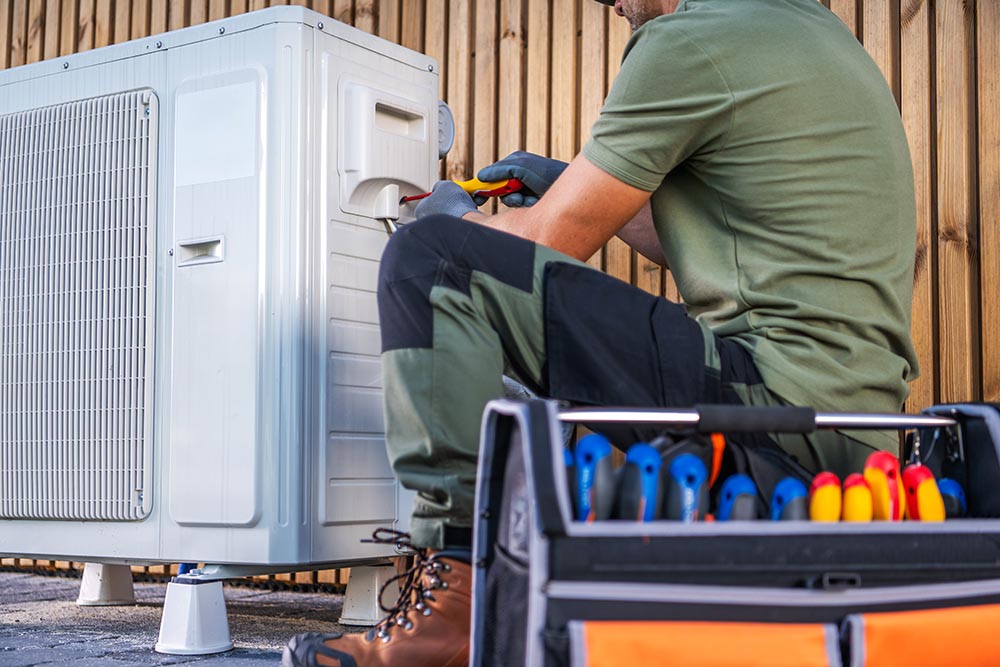 Technician Performing Maintenance on an Outdoor Air Conditioning Unit in a Residential Area Air conditioning Diagnostics, AC Diagnostics